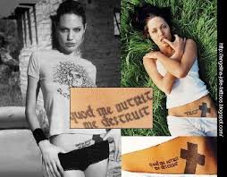 A bold cross sits on her left hip. Angelinajolie S Blog