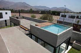 How are swimming pools constructed on top of buildings? House With Rooftop Pool