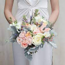 Learn how to make bridal bouquets, corsages, boutonnieres, centerpieces and church decorations. Sugared Almond Bridal Bouquet Wedding Flowers The Real Flower Company