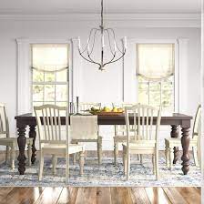 It includes an extendable dining table with an umbrella hole, plus eight stackable wicker dining chairs for easy storage. Milner Extendable Dining Table Reviews Birch Lane