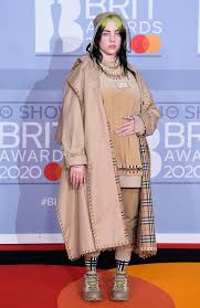 June's cover star billie eilish wears a custom burberry trench and corseted body, with mugler stocking boots. Billie Eilish Wears Lingerie On Cover Of British Vogue Photos