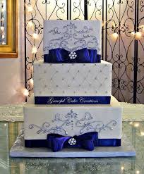 Buttercream wedding cake with cascading roses. Elegant Square Wedding Cake With Purple Ribbon And Silver Scrolls Wedding Cakes Blue Purple Wedding Cakes Royal Blue Wedding Cakes