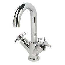 With thermostatic faucets, thanks to the modern thermostatic cartridge, the control by means of metal handles is comfortable and precise. Swirl Minimalist Bathroom Basin Mono Mixer Tap With Pop Up Waste Basin Taps Screwfix Com