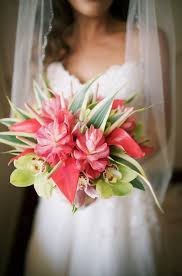 Happy young wedding couple in the park. Bright Tropical Bridal Bouquet With Ginger Anthuriums And Cymbidium Orchids Tropical Bridal Bouquet Wedding Boquet Wedding Flowers