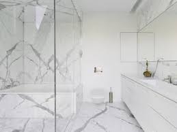 This stunning master bathroom has a contemporary mono chromatic color palette of whites and greys. Tub And Shower Combos White Marble Bathrooms Marble Bathroom Designs Modern Master Bathroom