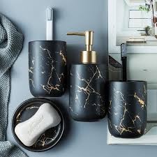 This black marble bathroom uses solid marble slabs all around the area of the bathroom itself, it also has herringbone mosaic that placed higher so it's out of the splash zone. Black Marble Bathroom Set Oyriss Home