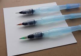 Once you've mixed your paint, saturate your brush in the paint and then wipe off the excess on the rim of your paint tray. How To Use Watercolors In Your Planner A Simple Water Brush Pen Tutorial Littlecoffeefox