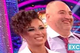 Russell Brand gets cosy with Miss Great Britain Gemma Garrett