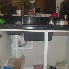 kitchen sink with exposed plumbing