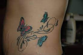 My Rebirth Tattoo Large Butterfly Represents Me The One Closest To The Top Represents My Butterfly Tattoo Meaning Rebirth Tattoo Butterfly Tattoo Designs