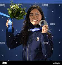 Japan's Tomoka Takeuchi holds her silver medal during the victory ceremony  for ladies' snowboard parallel giant slalom at the Sochi 2014 Winter  Olympics on February 19, 2014 in Sochi, Russia. UPIBrian Kersey