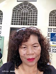 Hello friends. This is a photo of my dad mom and me. Mr. Deodath  Lalbeharry. Aka teach.