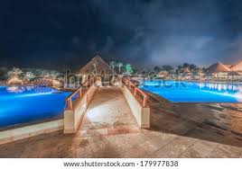 We stayed in the new hotel there. Bridge Over The Swimming Pool At Luxury Caribbean Resort At Night Dawn Time Bahia Principe Riviera Maya Mexican Resort Stock Images Page Everypixel