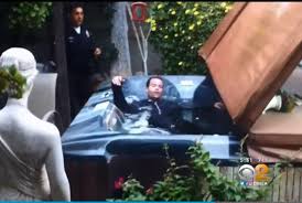 Watch: Unconscious man arrested after hiding in covered Jacuzzi