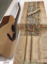 This is a traditional wedding collection with artistic chumki work.the set is outlined with naksi. Green Color Soft Muga Silk Digital Printed Saree