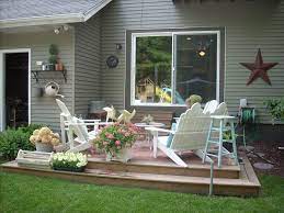 Ornate front porch with thick landscaping. Pin By Sheila Roberts Veatch On For The Home Deck Decorating Uncovered Patio Ideas Uncovered Deck Decorating