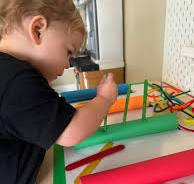 Counting activity with paper towel rolls and popsicle sticks