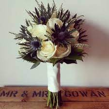 Yes, it is the thistle, which most considers common weeds. A Classic Scottish Thistle Heather And Avalanche Rose Bouquet Thistle Wedding Wedding Flowers Scottish Wedding