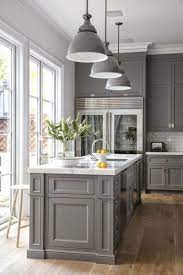 A stainless steel range and oven is flanked by classic white cabinets with nickel hardware. Explore Kitchen Lighting Ideas On Pinterest See More Ideas About Kitchen L Explore Kit Kitchen Design Kitchen Interior Kitchen Cabinet Design