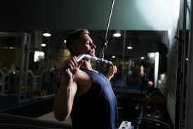 During the concentric and eccentric phrase, the shoulder, elbow and wrist move. Using The Lat Pulldown Machine Proper Form Technique