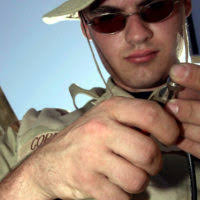 US Air Force (USAF) STAFF Sergeant (SSGT) Adam Baughman, 321st  Expeditionary Communications Squadron (ECS), performs an audio check