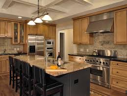 Carved, painted, inlaid with gold, or minimalistic flat panels are some of the varieties of dark wood style cabinetry you'll see in this collection. Amazing Kitchen Range Hood With Solid Wood Kitchen Cabinetry Combined Black Counter Top Also Dark Kitchen Island And Granite Table Top Under Cup Pendant Lamp Featuring Leather Chairs Ideas Chromed Kit Murphy Nc Real Estate Search Remax