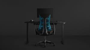 a full gaming setup with an embody gaming chair pulled up to the motia gaming desk with an ollin monitor arm on top herman miller gaming furniture gaming desk