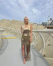 Lindsey Vonn Flaunts Legs In A Gold Mini Dress In New IG Photos