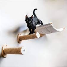 This can be used as a structure that's mounted lower to the floor to enable your cat to jump to the lower cat hammock, then jump up to the top hammock for lounging or mounting above your couch. Amazon Com Wall Mounted Cat Hammock With Two Steps Modern Beds And Perches For Cats Premium Kitty Furniture For Sleeping Playing Climbing And Lounging Cat Wall Shelves Kitchen Dining