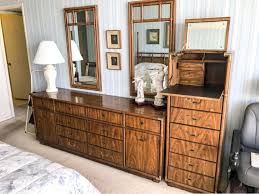 Additionally, the company also offered furniture for commercial markets. Vintage Drexel Heritage Campaign Style Bedroom Set With Long Chest Of Drawers Highboy Chest Of Drawers With Flip Top Mirror And Pair Of Wall Mirrors