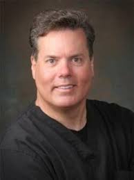 Justin M. Young , DDS, MD