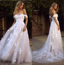 Explore a new variety of wedding dresses at promlily.com.the wisdom and skill of expert seamstresses transform fine fabrics into haute couture designs. Discount New Country Boho Wedding Dresses 2020 Sexy Backless A Line Off Shoulder Appliqued Tulle Long Summer Bridal Gowns Bohemian Bm1510 Plain Wedding Dresses Sexy Wedding Gowns From Misshowdress 97 4 Dhgate Com