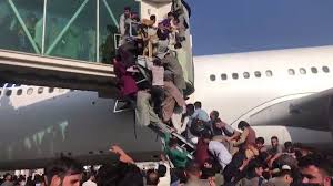 The chaotic and tragic scenes at the airport after the fall of kabul to the taliban are likely to become a defining symbol of the west's failure in afghanistan. Kabul Airport Plunges Into Chaos As Taliban Patrols Afghanistan Capital