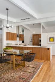 It was a time when new materials such as plastic, stainless steel, and lucite were incorporated into furniture pieces, and new techniques were enthusiastically. This Mid Century Modern Kitchen Cooks Up A Storm Mid Century Modern Kitchen Design Interior Design Kitchen Mid Century Modern Kitchen