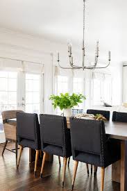 Even if your dining room has ample natural light, it's important to add one or two task lights to avoid eye strain. Two Day Transformation Dining Area Photo Tour Studio Mcgee In 2021 Black Dining Chairs Dinning Room Chairs Dining Chairs
