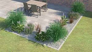 Ein Blumenbeet Vor Einem Haus Terrasse Umrandung Gartengestaltung Gartendekoration
