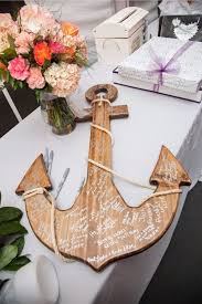 The Romantic And Relaxed Setting Among Sand And Sunshine Makes A Coastal Wedding Perfect For Beach Wedding Decorations Beach Theme Wedding Creative Guest Book