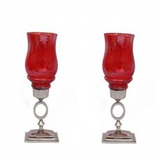 Want to create a display that effortlessly transitions from holiday to everyday? Buy Sutra Decor Red Glass Hurricane Candle Holder Set Of 2 Online 1687 From Shopclues