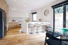 May 15, 2015 · these are large portable containers filled with living spaces and all of the conveniences of home. Modern Open Plan Kitchen With Island Bench And Bar Stools Stock Photo Picture And Royalty Free Image Image 48470595