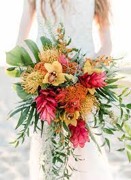 You may say that cascading bouquets aren't in trend but they have never stopped being fashionable for tropical weddings because there's much cascading greenery and blooms to choose from and such bouquets look wow. Heavenly Beach Weddings I Do Y All Tropical Wedding Flowers Tropical Wedding Bouquets Wedding Bouquets