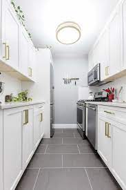9 Space Enhancing Ideas For Your Galley Kitchen Remodel Whitegalleykitchens Our Professiona Galley Kitchen Remodel Kitchen Remodel Small Galley Kitchen Layout