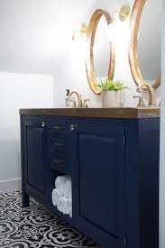 This freestanding features durable solid wood & plywood cabinets in stunning blue with a white manufactured stone vanity top and brushed silver hardware. Modern Farmhouse Entryway Design Ideas Clark Aldine Gold Bathroom Fixtures Blue Bathroom Vanity Bathroom Fixtures