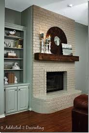 family room makeover a dark wood paneled room gets an update white brick fireplace home fireplace makeover