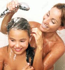 Mother And Daughter Showering In The Bathroom Stock Photo, Picture and  Royalty Free Image. Image 22413337.