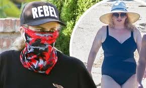 Rebel wilson stunned in a white swimsuit for an underwater photo shoot. Rebel Wilson Takes A Walk After Flaunting Swimsuit Body On Vacation Flipboard