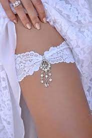 Today, the practice of removing the bride's garter is traditionally reserved to the groom, who will then toss the garter to the unmarried male guests. 24 Exquisite Wedding Garters For Perfect Wedding Look Wedding Garter Lace White Wedding Garter Wedding Accessories