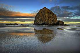 Haystack Rock Reflection In Cannon Beach Oregon Coast At Sunrise Cannon Beach Oregon Cannon Beach Oregon Travel
