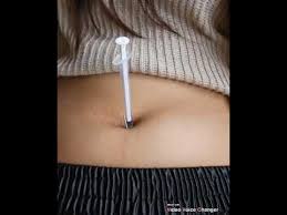 Inserting a 2 inch needle into the navel. Wn Belly Button Navel Needle Torture Riva