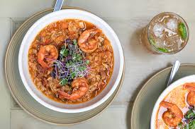 Classic new orleans deep fried donut pastry covered with powdered sugar. Wharf Southern Kitchen Whiskey Bar