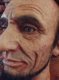 Melting wax Lincoln sculpture in DC's hot summer